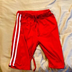 They are red athletic shorts they are size medium